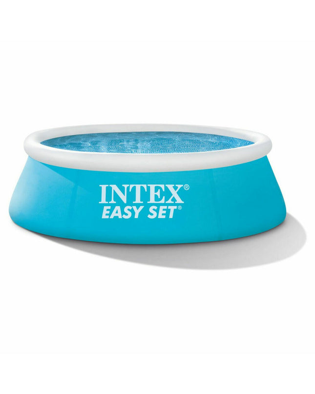 Intex Easy Set inflatable swimming pool with 183x51 cm size, filled with water, set up outdoors for summer fun.