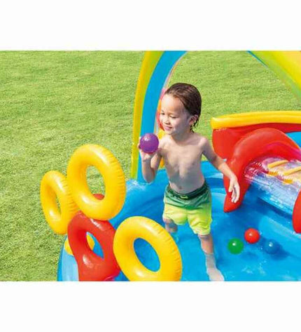 Intex inflatable children's rainbow pool with slides, measuring 297x135x193 cm, filled with water and set up outdoors.