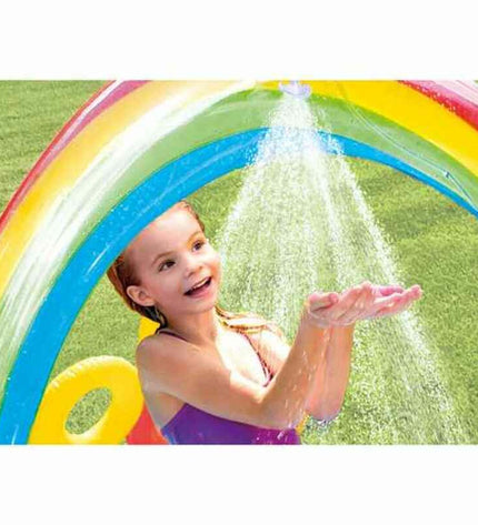 Inflatable Intex children's rainbow play pool with colorful design, measuring 297x135x193 cm, filled with water and suitable for outdoor fun.
