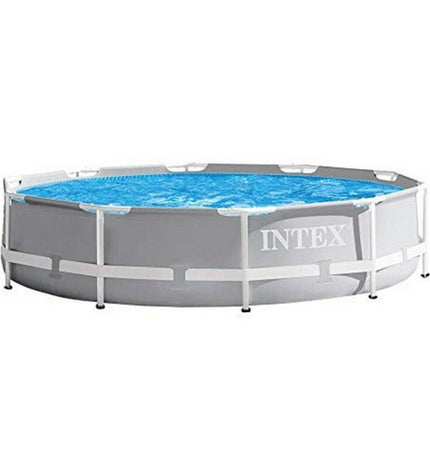 Intex 26700NP removable pool in garden, showing the 305 x 76 cm inflatable swimming pool with blue sides and water inside