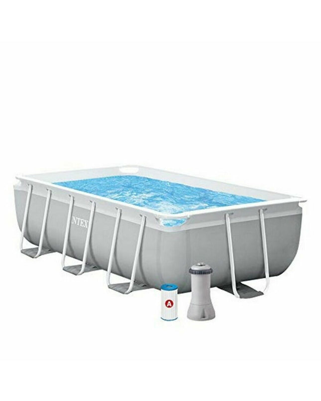 Intex 26784NP removable swimming pool in garden, 300x80x175 cm, 3539 L capacity, outdoor pool setup with water inside.