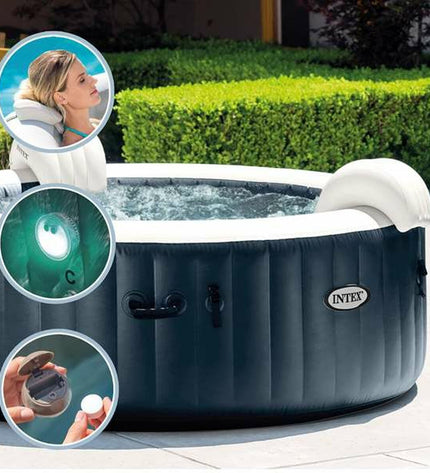 Intex Opblaasspa Puresoa Burbujas Plus inflatable hot tub with bubbling jets, set up outdoors in a garden.