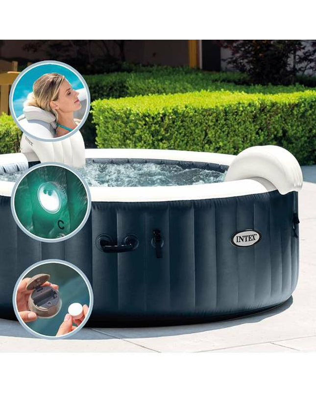 Intex Opblaasspa Puresoa Burbujas Plus inflatable hot tub with bubbling jets, set up outdoors in a garden.