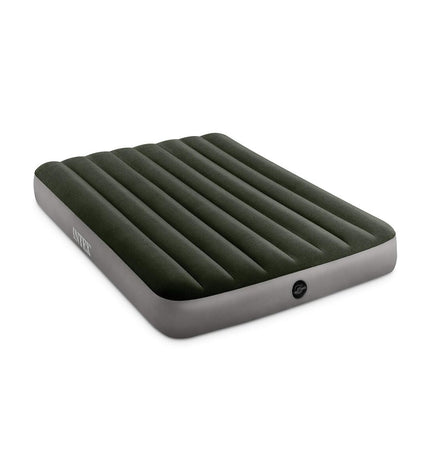 Intex air mattress 137x25x191 cm for outdoor camping and sports, shown inflated on a camping site.