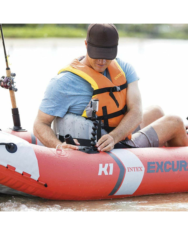 Inflatable kayak Intex Excursion Pro in blue with black accents, featuring seating area and paddles, suitable for outdoor watersport adventures.