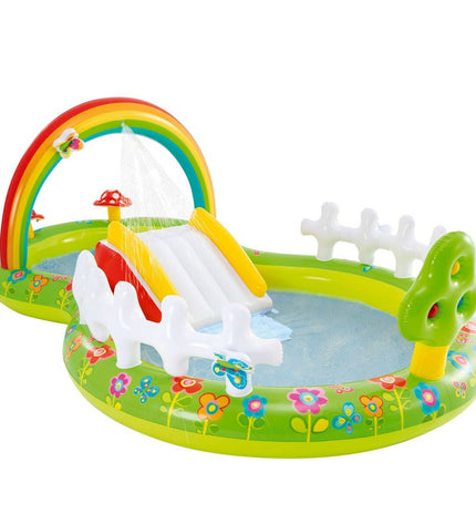 Inflatable Intex children's pool in the garden, featuring colorful design, perfect for outdoor summer play.
