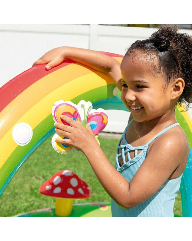 Inflatable children's swimming pool by Intex, in a garden setting, featuring vibrant colors and a playful design for kids.