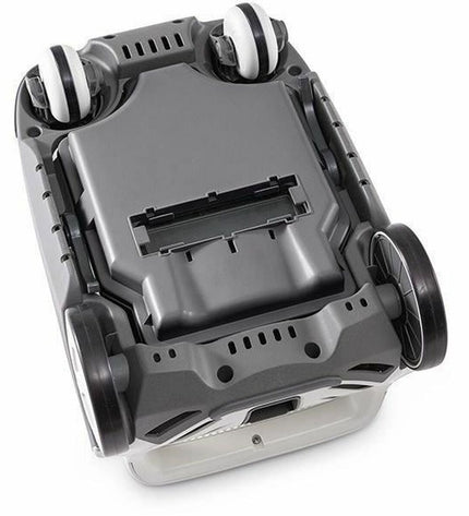 Intex automatic pool cleaner for garden pools, showing the compact device with hoses on a poolside.
