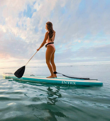 Inflatable Intex Aqua Quest SUP board with accessories, blue and white, designed for water sports and outdoor activities.