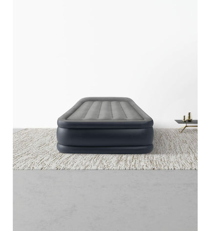 Intex Dura-Beam Basic Deluxe twin air mattress with dimensions 99 x 42 x 191 cm, suitable for camping and outdoor use.