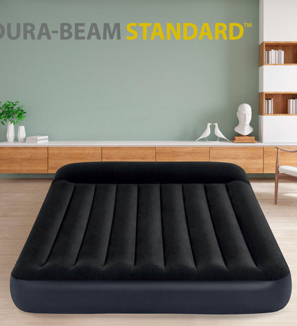 Intex air mattress measuring 152 x 25 x 203 cm, suitable for camping and outdoor activities, with a durable design.