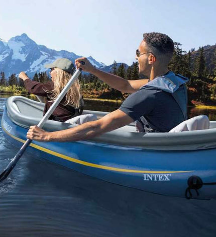 Intex Wyoming inflatable kayak for watersports, shown partially inflated with bright colors and seating area, measuring 307 x 89 x 53 cm