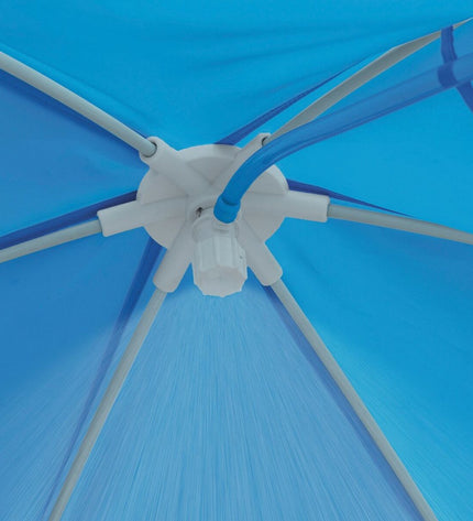 Intex removable swimming pool in garden, 183x38x183 cm, with clear water, set up outdoors for summer fun.