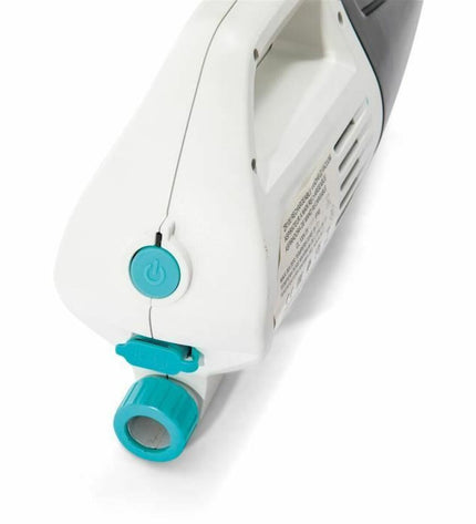 Intex ZR100 pool vacuum cleaner for swimming pools, shown on a tiled pool deck with hoses and equipment.