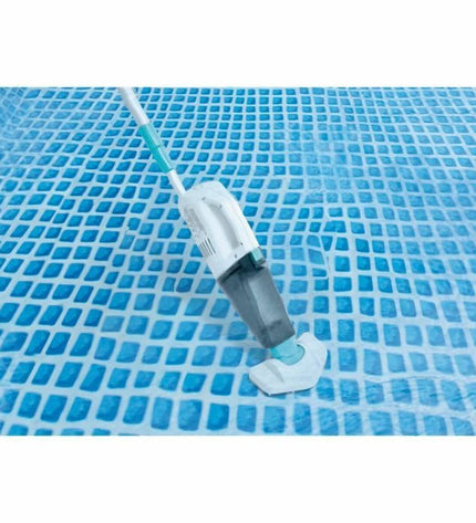 Intex ZR100 pool vacuum cleaner for swimming pools, showing the compact device with hose attachments on a tiled pool deck.