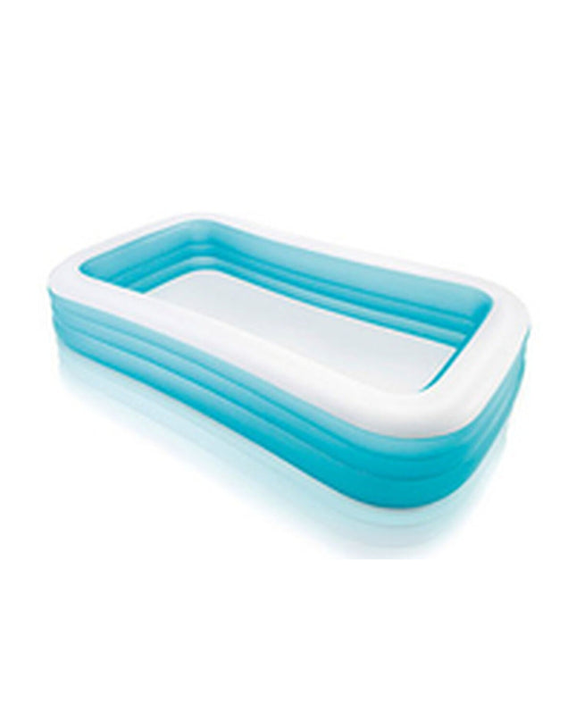 Intex inflatable swimming pool with 305x56x193 cm size, set up outdoors in a garden area, ready for summer fun.
