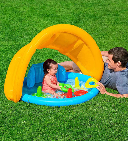 Bestway inflatable children's pool with removable canopy, measuring 115x89x76 cm, suitable for outdoor play in the garden.