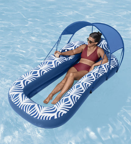Bestway air mattress with sunshade, 198x112 cm, in vibrant blue with plush surface, designed for beach and pool use.