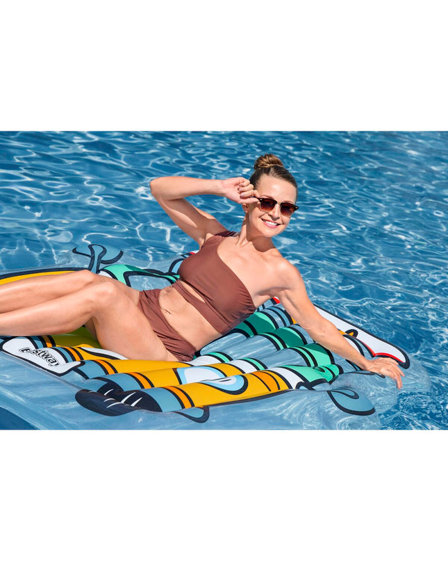 Inflatable Bestway mattress for outdoor use, shown deflated on a flat surface, ideal for camping or relaxation activities.
