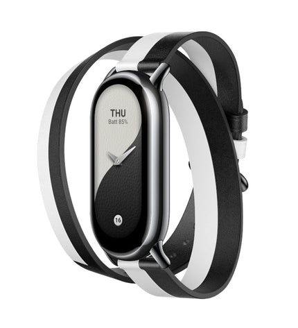 Xiaomi Band 8 wrap-style black and white silicone watch strap for sport and outdoor use, shown on a wrist.
