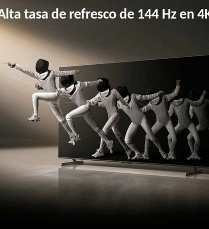 Xiaomi 4K Ultra HD 100-inch QLED Smart TV displaying vibrant images in a modern living room setting.