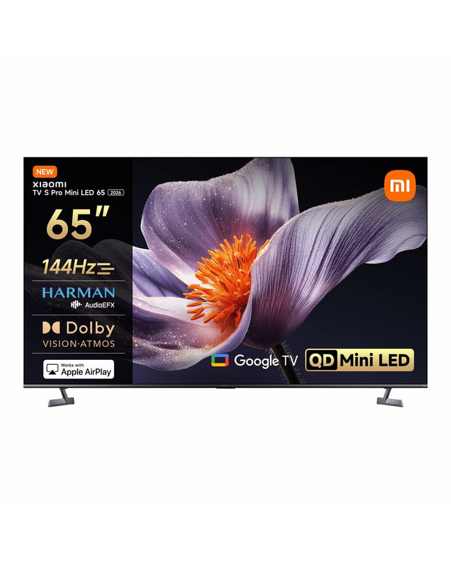 Xiaomi ELA6318EU 4K Ultra HD QLED Smart TV displaying vibrant images on a modern living room wall.