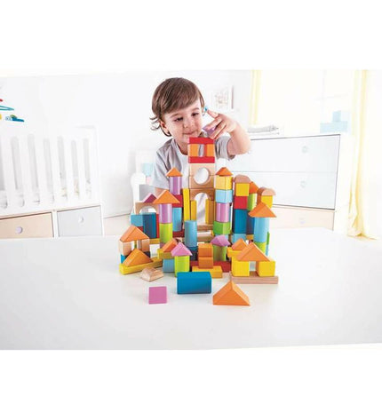 Hape building toy with 101 colorful blocks and construction pieces in a 27x22x13 cm box, suitable for creative play.