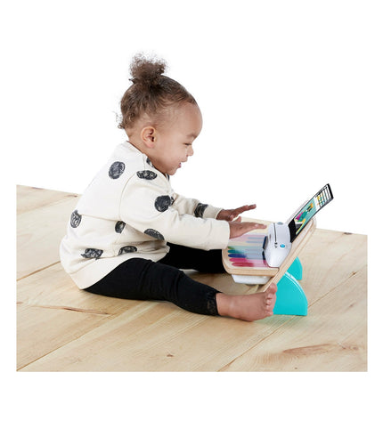 Baby Einstein Magic Touch interactive baby piano with colorful keys and touch-sensitive surface, designed for children's musical play.