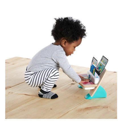 Baby Einstein Magic Touch interactive baby piano with tactile keys, compact 30x14x17 cm musical toy for children.