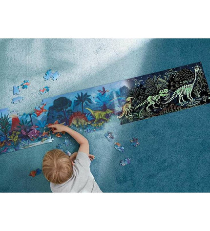 Hape dinosaur puzzle with 150 pieces, 150x30 cm, featuring detailed dinosaur images and colorful interlocking pieces.