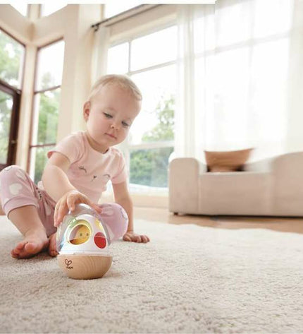 Hape baby toy with five colorful wooden pieces for young children, designed for early development and play.