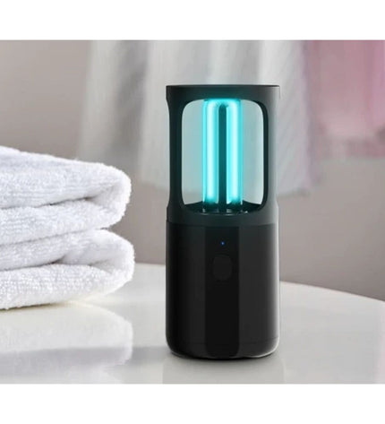 Xiaomi UV-sterilisator ZW2.5D8Y-08 for outdoor garden decoration, shown in a natural outdoor setting with greenery.