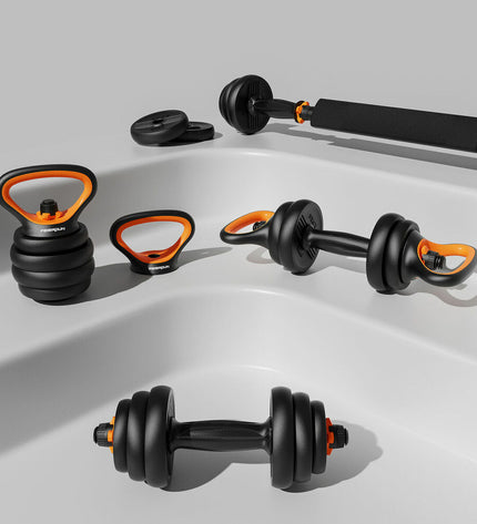 Xiaomi FED V2 40Kg dumbbells for fitness and outdoor workouts, black with textured grip, shown on a gym floor.