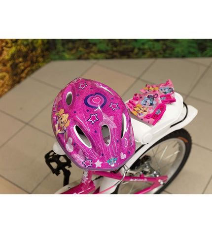 Pink children's bike helmet featuring Paw Patrol branding, designed for outdoor cycling and sporty activities.