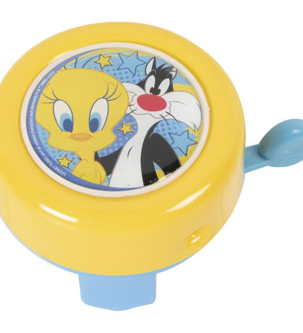 Yellow Looney Tunes bike bell for kids' bicycle, featuring cartoon character design, suitable for outdoor and cycling use.