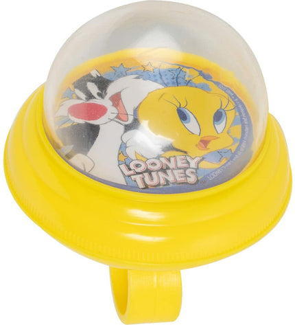 Yellow Looney Tunes bicycle bell for kids, featuring cartoon character design, mounted on a bicycle handlebar for outdoor riding.