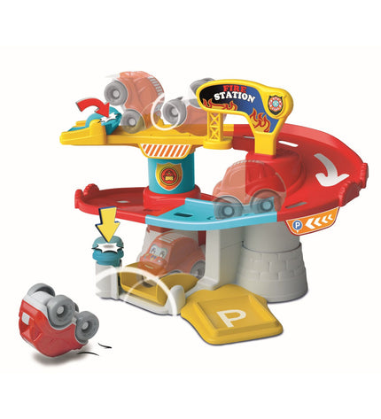 Clementoni race track toy with colorful vehicles on a play table, part of Clementoni's toy and game vehicle collection.