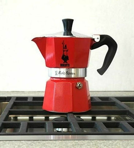Red Bialetti Italian coffee pot with 3 cups, made of aluminum, designed for brewing traditional espresso on the stove.