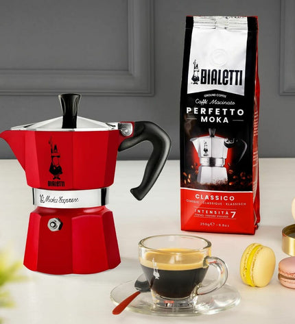 Red Bialetti Italian coffee pot with 6 cups, stovetop moka maker for rich espresso-style coffee.