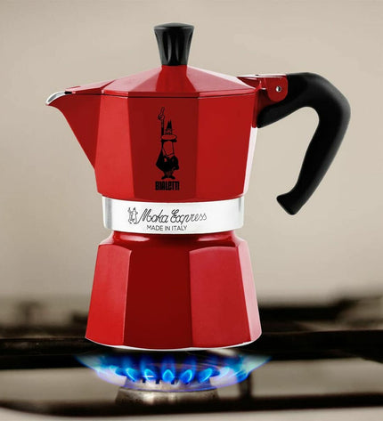Red Bialetti Italian coffee pot with 6 cups, perfect for brewing espresso at home, in a kitchen setting