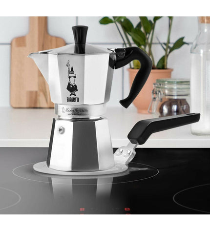 Black Bialetti Moka Express Italian coffee pot for stovetop brewing, with classic octagonal shape and handle.