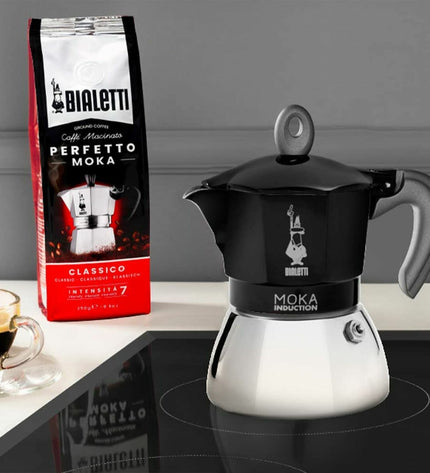 Black Bialetti Italian coffee pot made of aluminum for stovetop brewing, ideal for espresso and rich coffee.