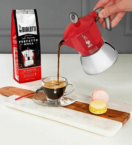 Red Bialetti Italian coffee pot made of metal aluminum, 150 ml, ideal for brewing espresso at home.