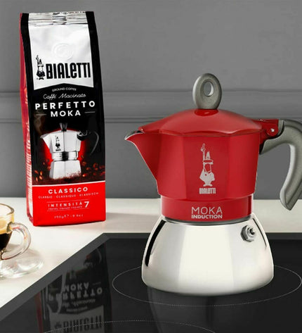 Red Bialetti Italian coffee pot made of metal aluminum, 150 ml for brewing authentic espresso at home.