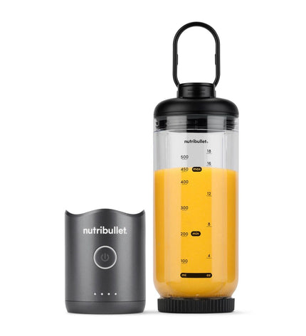 Nutribullet NBP013GM gray 600 ml mixer cup for kitchen blending, with a clear plastic body and secure lid, on a kitchen countertop.