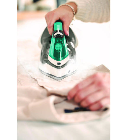 POLTI Q100 steam iron with 2400W power, shown with ergonomic handle and water tank, ideal for household ironing tasks.