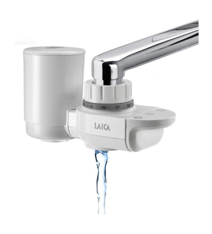 LAICA Venezia faucet filter for household water purification, shown attached to kitchen faucet in a home setting.