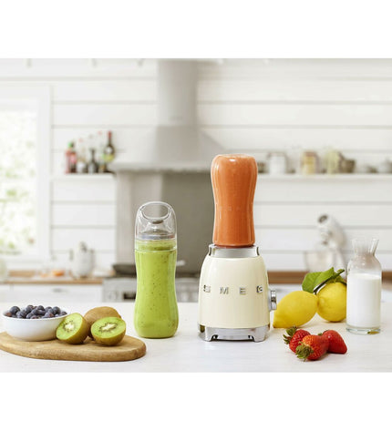 Smeg Crème Mixer with 300W motor and 600ml capacity, compact electric kitchen appliance for blending and mixing.