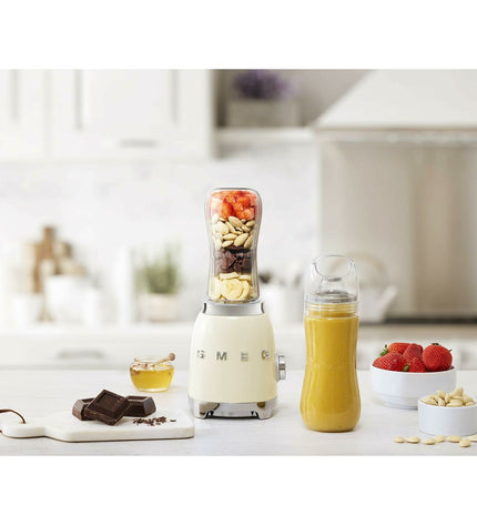 Smeg Creme 300W handheld mixer with 600ml capacity, ideal for home cooking and small electrical appliances in the kitchen.
