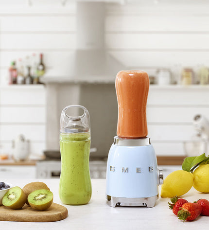 Smeg PBF01PBEU blue 300W hand mixer with beaters, compact small kitchen appliance for baking and cooking.